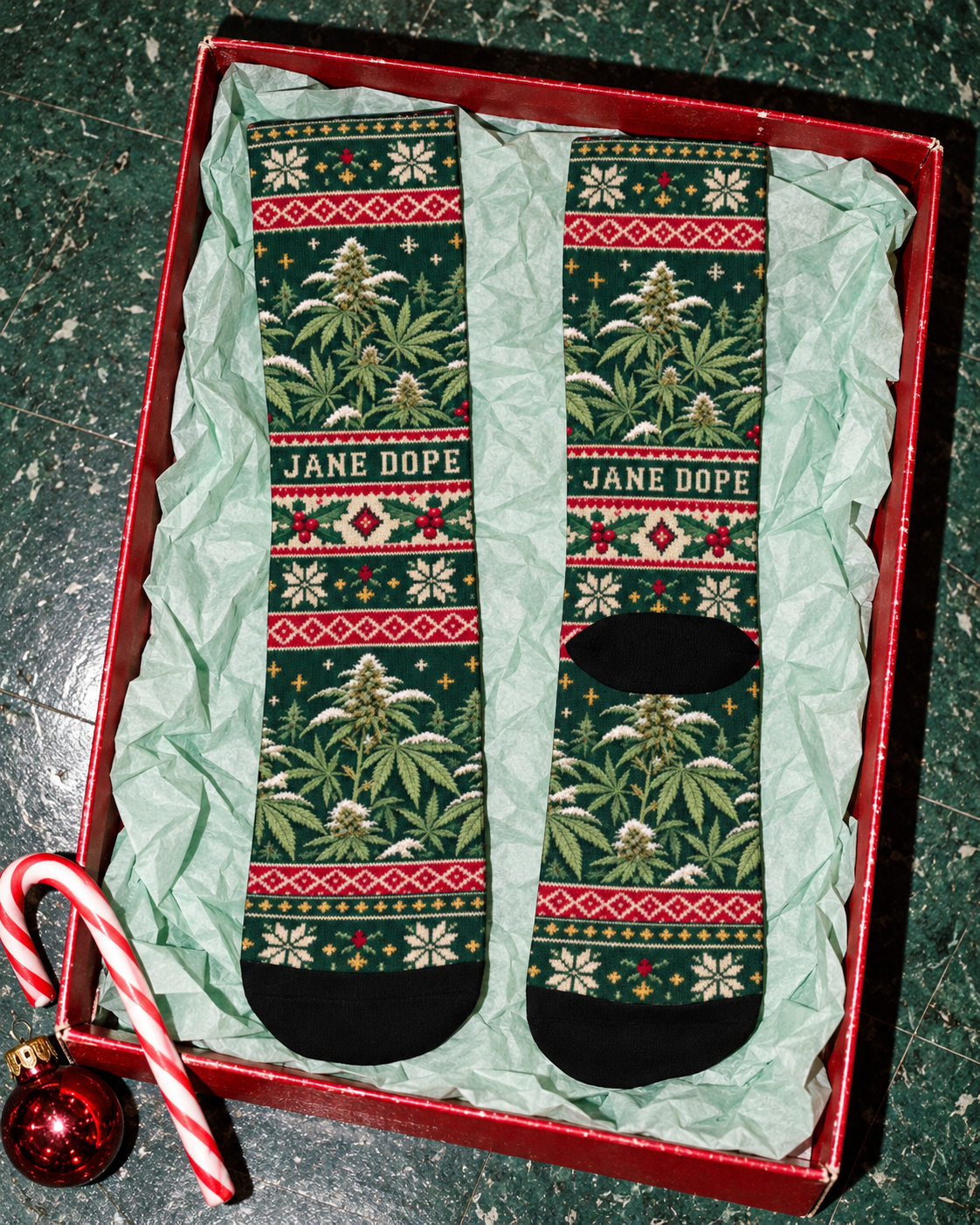 Nugs & Mistletoe crew socks shown front and back with black heels and toes on green gift tissue.