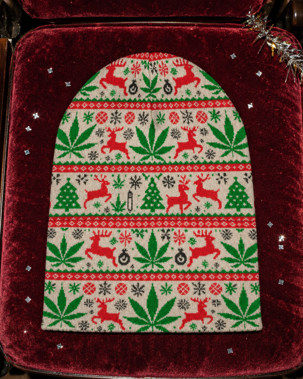 OG Xmas Beanie laid flat with cuff unfolded, showing its full length and all-over holiday artwork