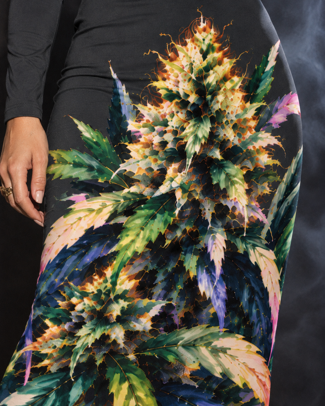 Detail of the Permanent Marker Hip Dress green, gold, pink and violet botanical artwork printed on charcoal fabric.