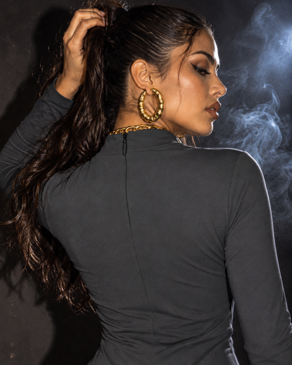 Close-up of the Permanent Marker Hip Dress black centre-back zipper and high collar, with hair held away from the closure.
