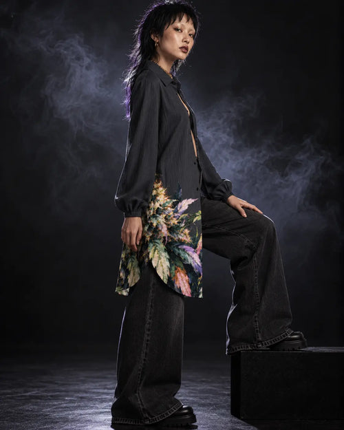 Side view of Permanent Marker shirt dress half buttoned over charcoal denim, showing the curved hem.