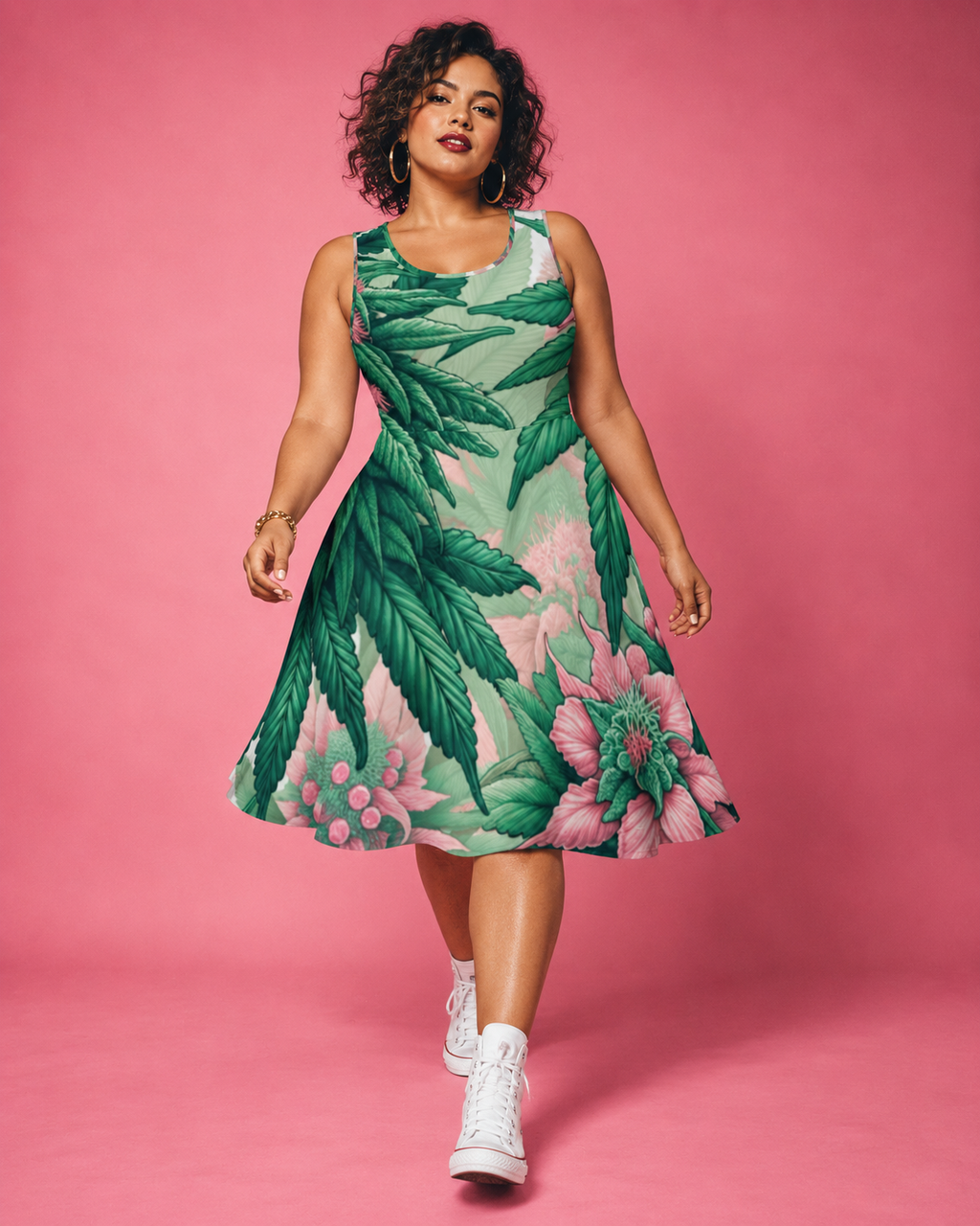 Pink Haze botanical skater dress, walking front view with a curly bob and white high-top sneakers.