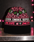Sleigh Smoke Repeat cotton-blend knit beanie with pink leopard motifs, green leaves and a solid black band, front view.