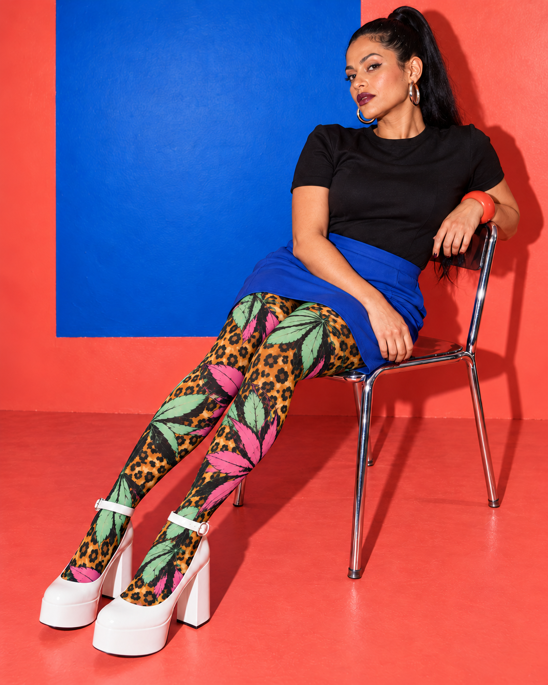 Runtz pink and mint botanical leopard tights, seated on a chrome chair with white platform shoes. AI editorial illustration; styling accessories not included.