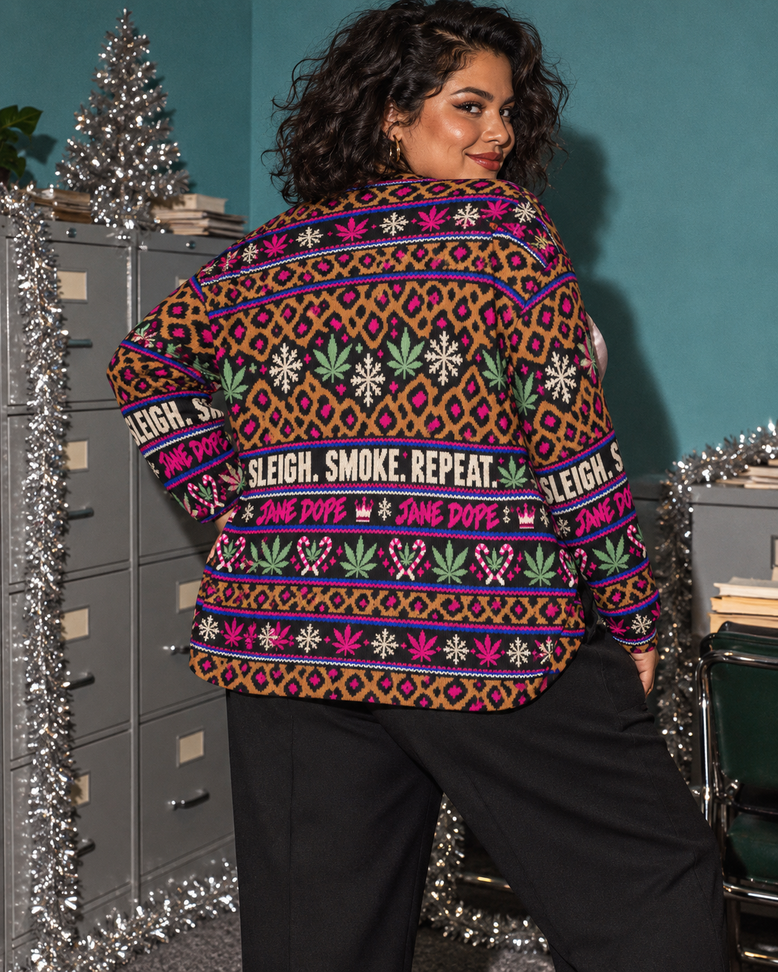XL variant editorial: back of the Sleigh. Smoke. Repeat cardigan showing the full printed slogan