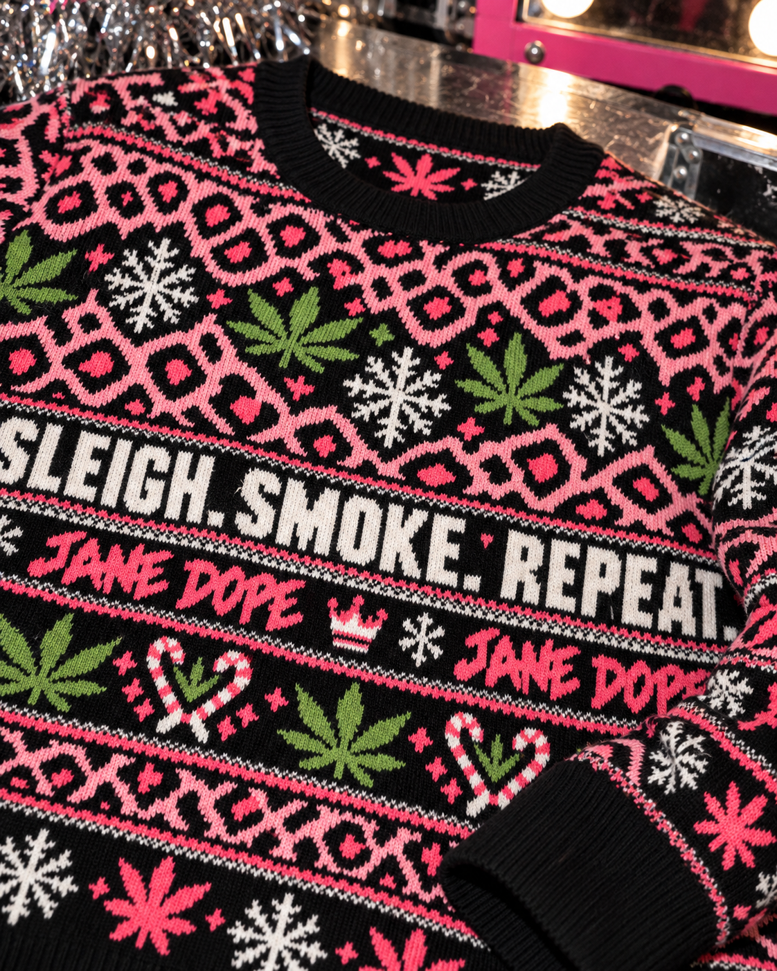 Sleigh Smoke Repeat Xmas Knit Sweater (unisex) jacquard detail showing fine yarn loops, JANE DOPE lettering and black ribbed cuff