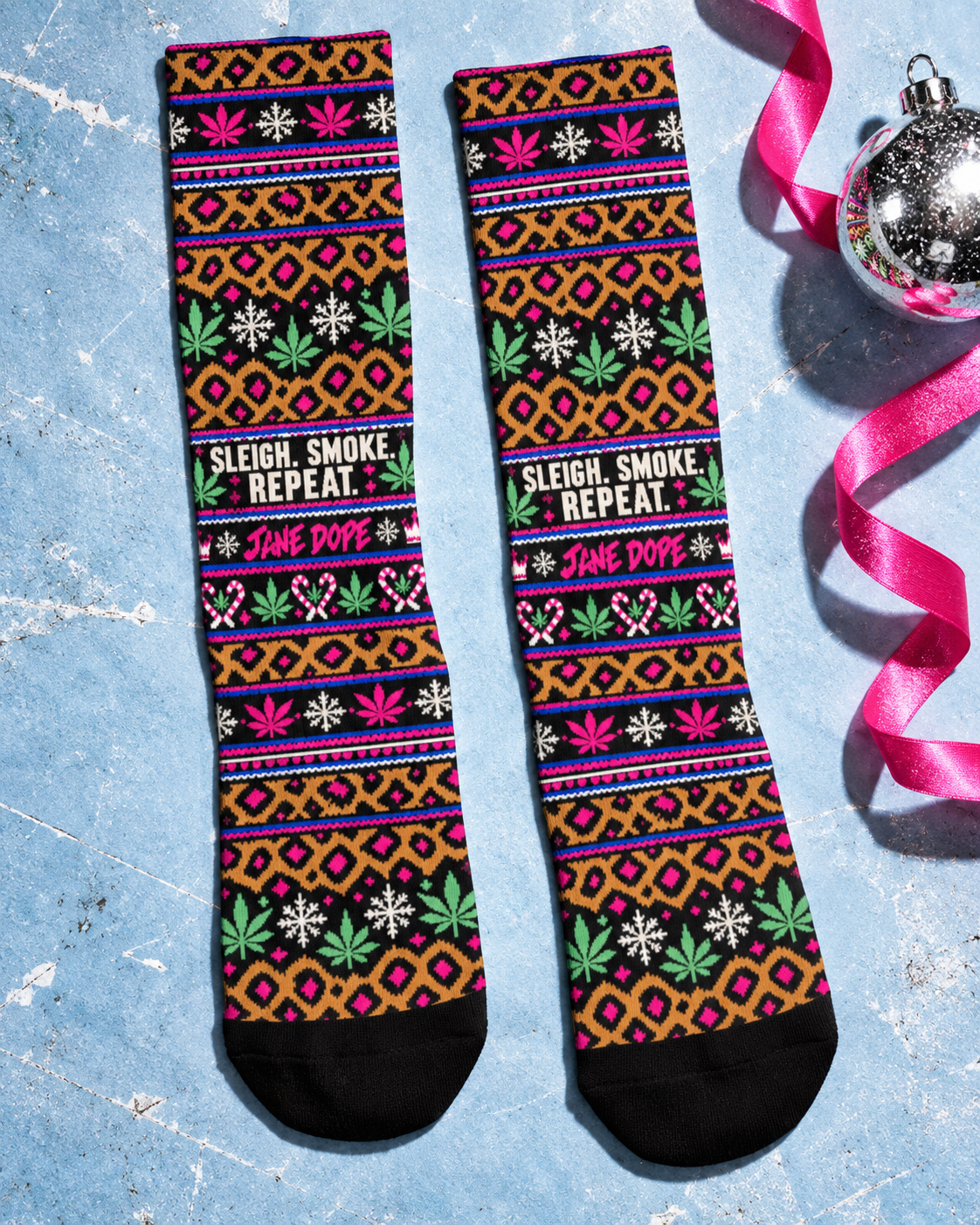 Sleigh Smoke Repeat long socks laid flat on icy blue paper, showing the full leopard holiday print and black toes.