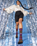 Sleigh Smoke Repeat crew socks worn at mid-calf with an ivory blouse and black shorts.