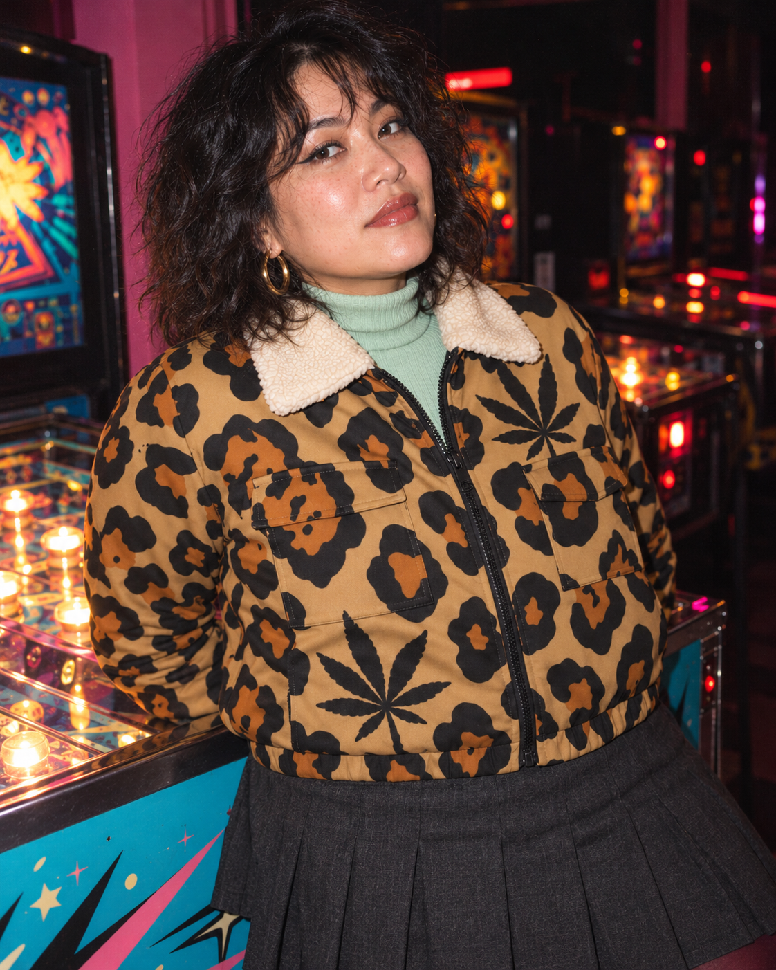 Close frontal arcade portrait showing the Leopard jacket cream collar, black zip, flap pockets and cropped hem.