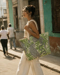 Leopard print canvas tote with hemp rope handles, lifestyle shot on shoulder