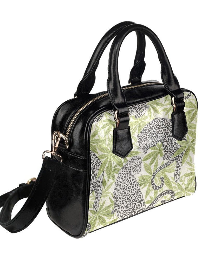 Leopard print leathery shoulder bag, side view with strap