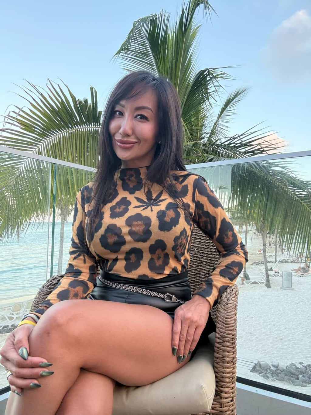 Leopard mesh long sleeve top, back view on model