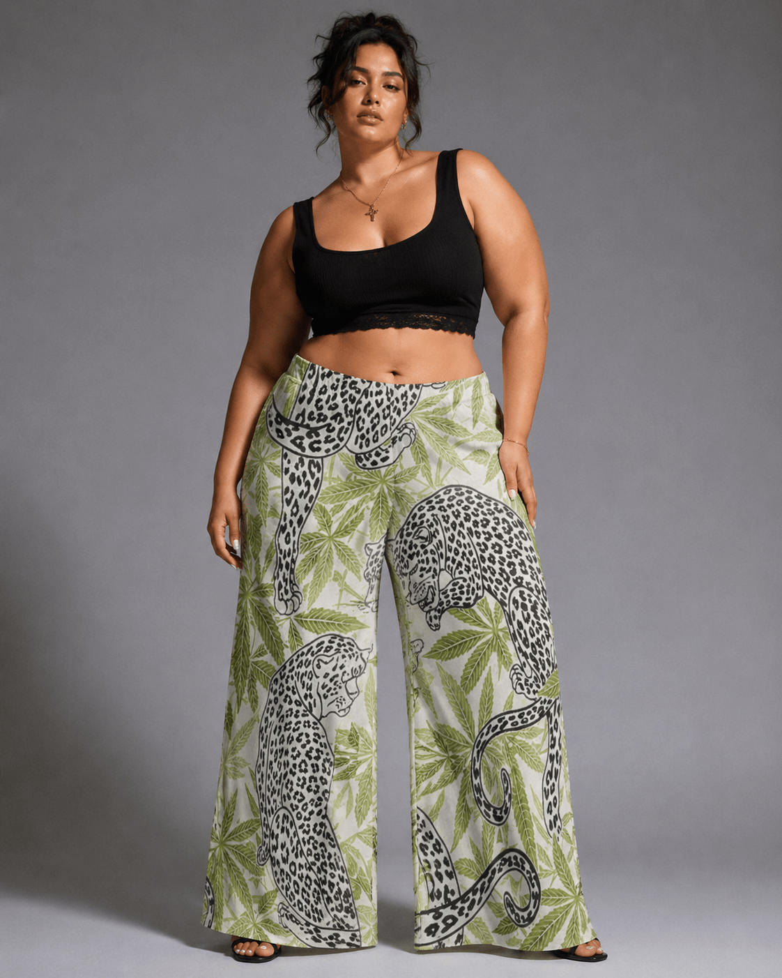 Leopard print wide leg pants, three-quarter view on model outdoors