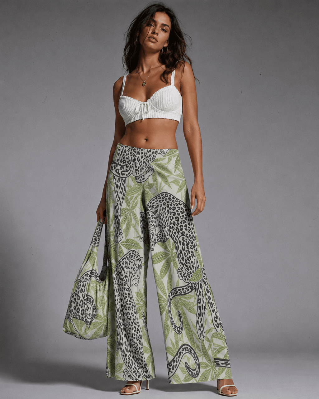 Leopard print wide leg pants, side view on model
