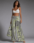 Leopard print wide leg pants, side view on model