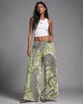 Leopard print wide leg pants, three-quarter view on model