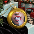 Design Christmas Balls gold ornament close-up of the photo print, raised rim and decorative cap