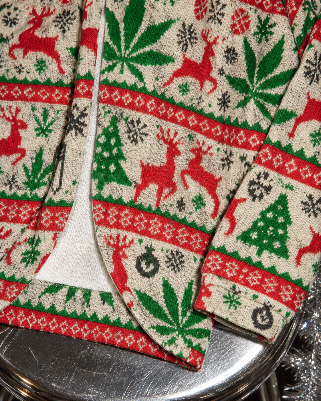 OG X-MAS Drop Shoulder Cardigan textured fabric, printed cuff and curved front hem close-up