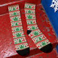 OG Xmas Socks full pair showing cream holiday print, green Herb leaves and black toes