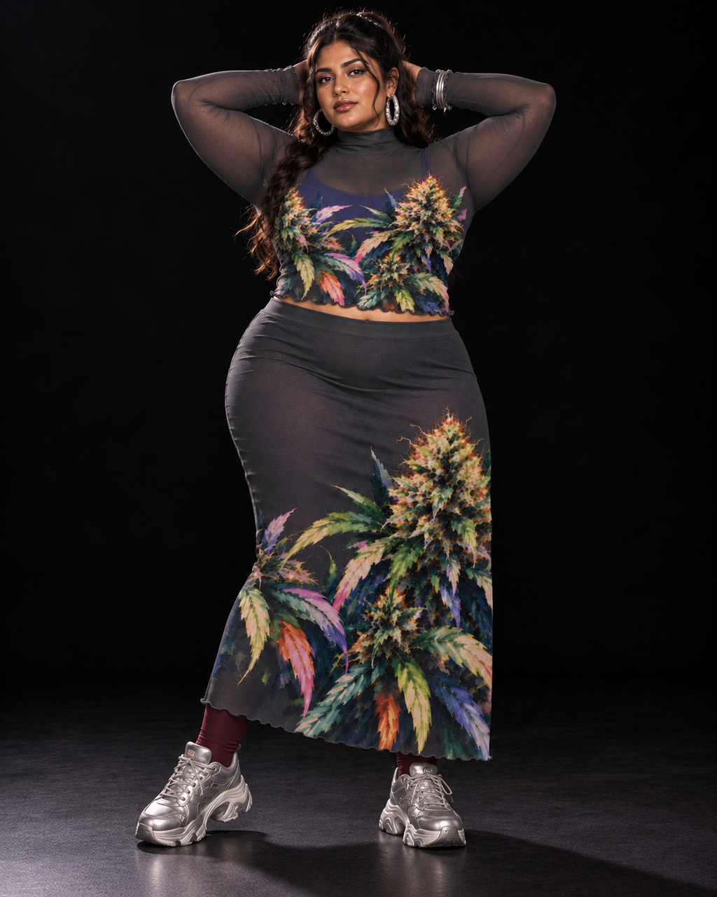 Permanent Marker botanical mesh top and skirt set, arms-raised pose with cobalt top and silver trainers. Styling layers and accessories not included.