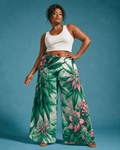 Pink haze floral print wide leg flow pants, walking shot showing fabric movement