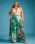 Pink haze floral print wide leg flow pants, seated lifestyle shot on model