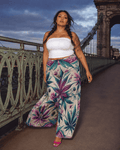 Graphic print wide leg flow pants, close-up showing fabric and print detail