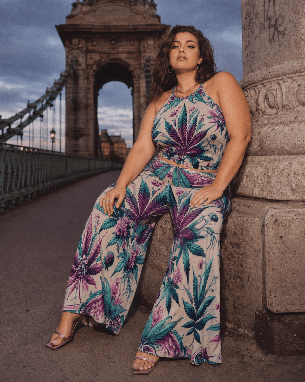 Graphic print wide leg flow pants, lifestyle editorial shot on model
