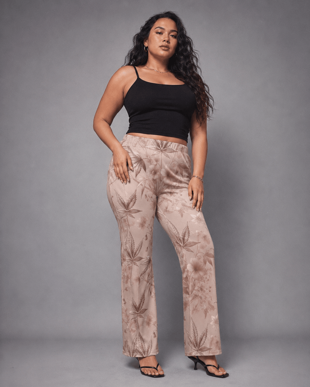 Rose graphic print flare pants, three-quarter view on model