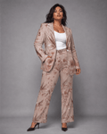 Rose graphic print flare pants, full length view on model outdoors