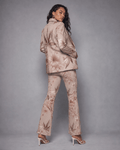 Rose graphic print flare pants, lifestyle editorial shot on model