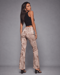 Rose graphic print flare pants, side view on model
