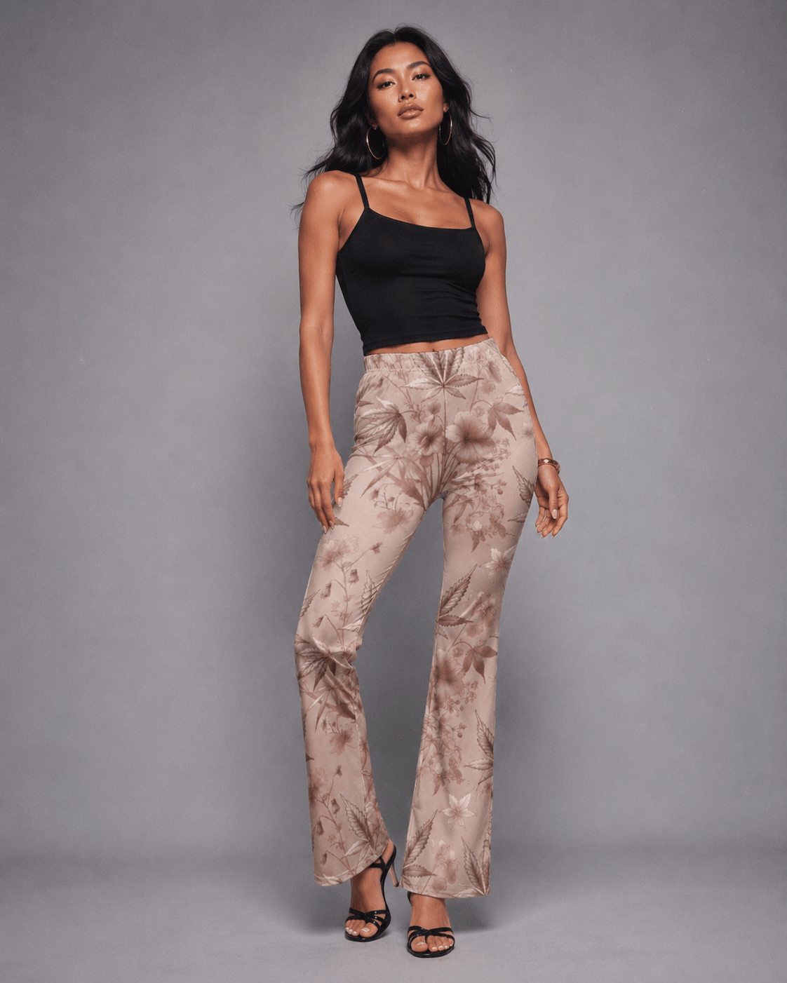 Rose graphic print flare pants, front view on model