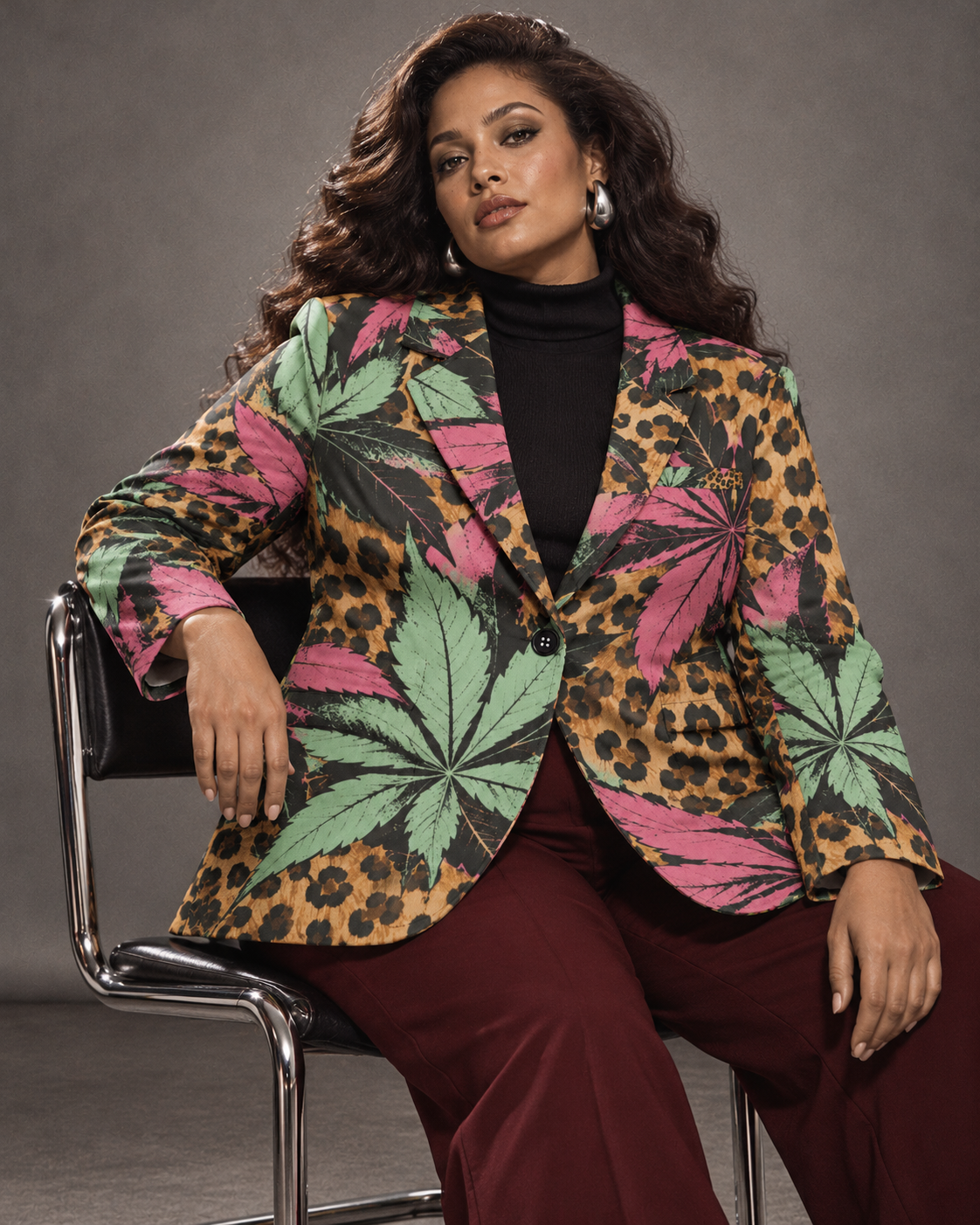 Runtz pink and mint botanical leopard-print blazer, seated with oxblood trousers and silver earrings. AI editorial illustration; styling accessories not included.