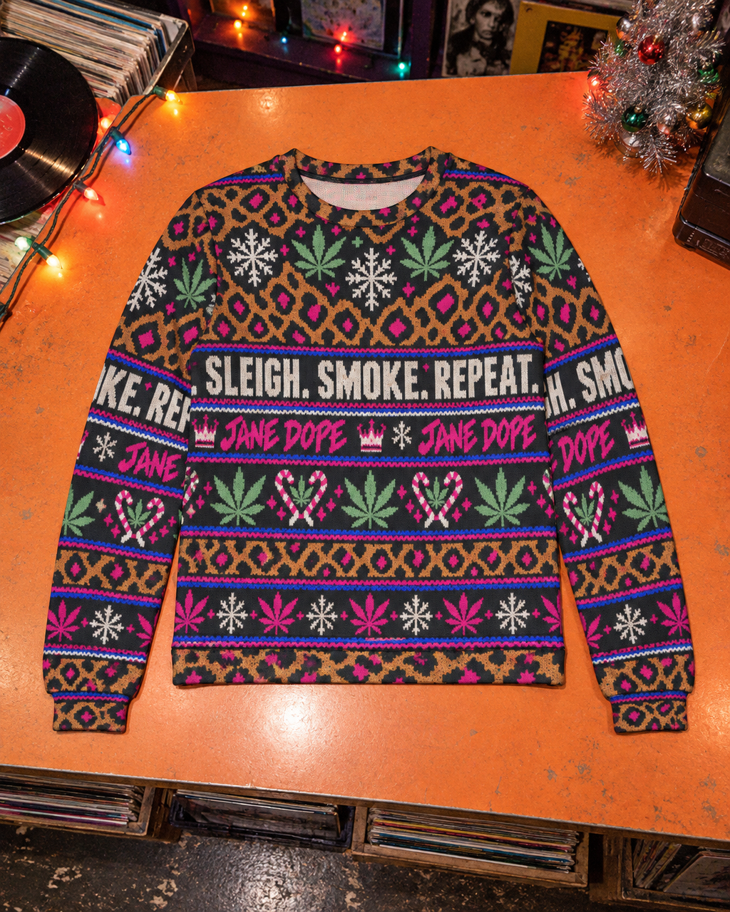 Full front of leopard holiday sweater with green Herb leaves and pink Jane Dope lettering