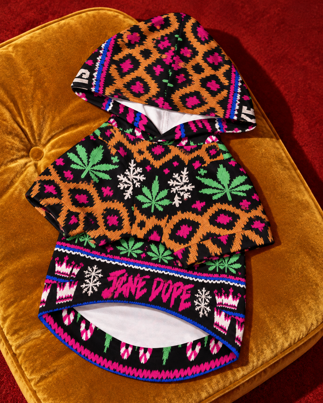 Sleigh Smoke Repeat dog hoodie laid chest-side up on a mustard cushion, showing the hood, short sleeves and belly opening. AI editorial illustration.