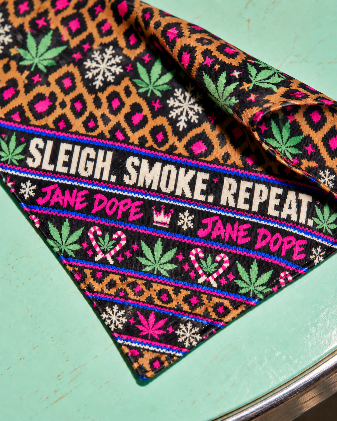 Close-up of Sleigh. Smoke. Repeat Dog Scarf printed fabric and stitched edge
