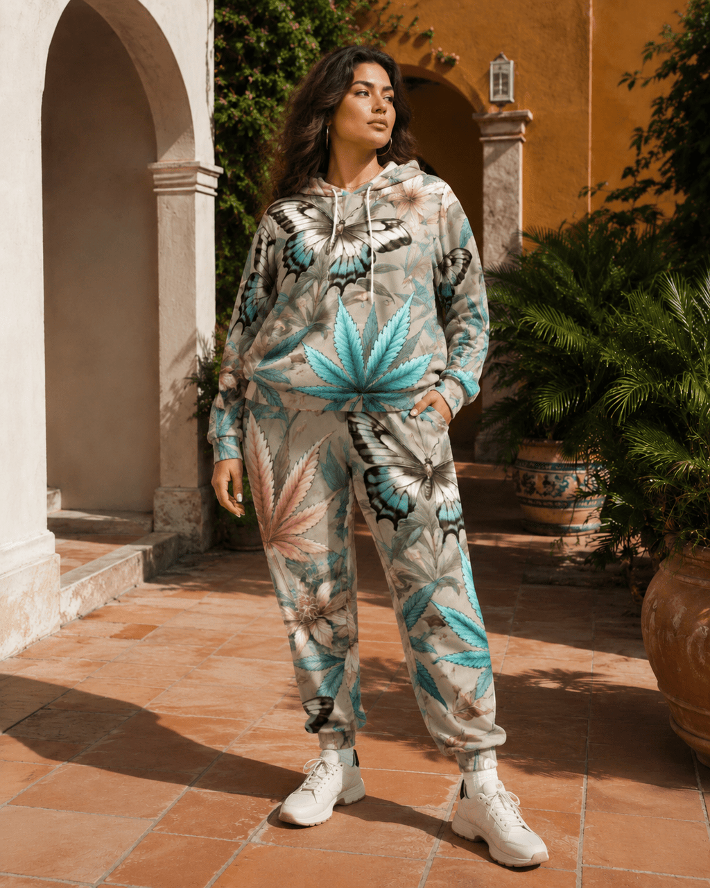 All-over print hoodie and sweatpants set, seated lifestyle shot on model