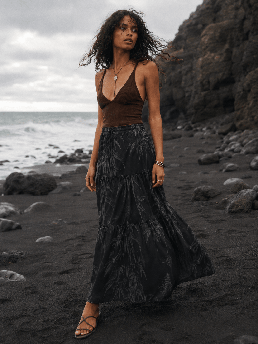 Ethereal smoke print tiered maxi skirt, three-quarter view on model outdoors