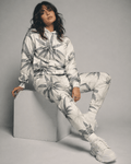 Green leaf print hoodie and sweatpants set, hood and pocket detail close-up