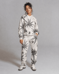 Green leaf print hoodie and sweatpants set, back view on model