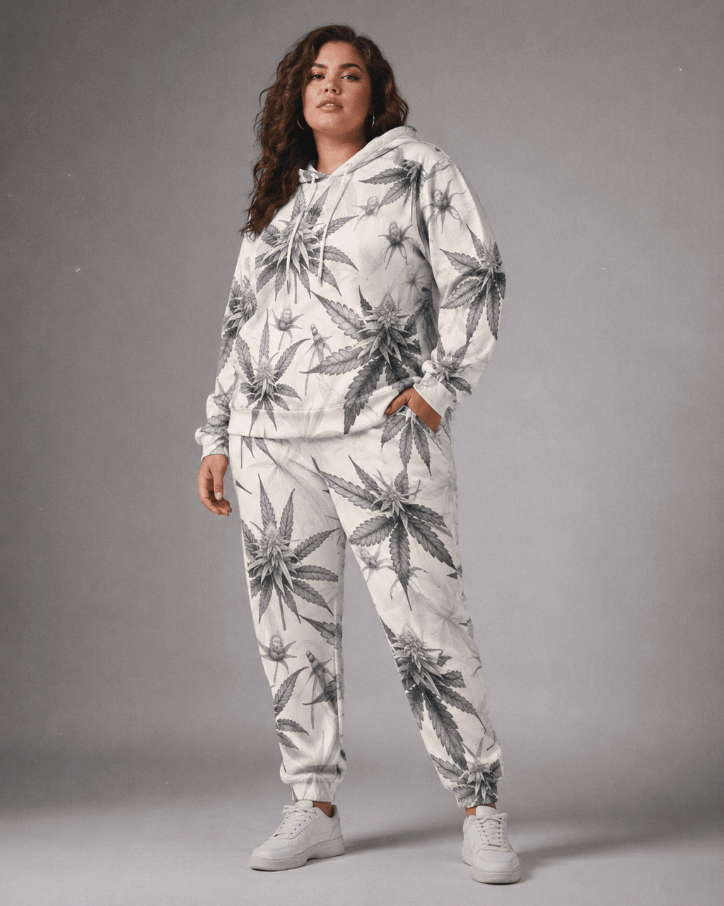 Green leaf print hoodie and sweatpants set, close-up showing fabric and print detail